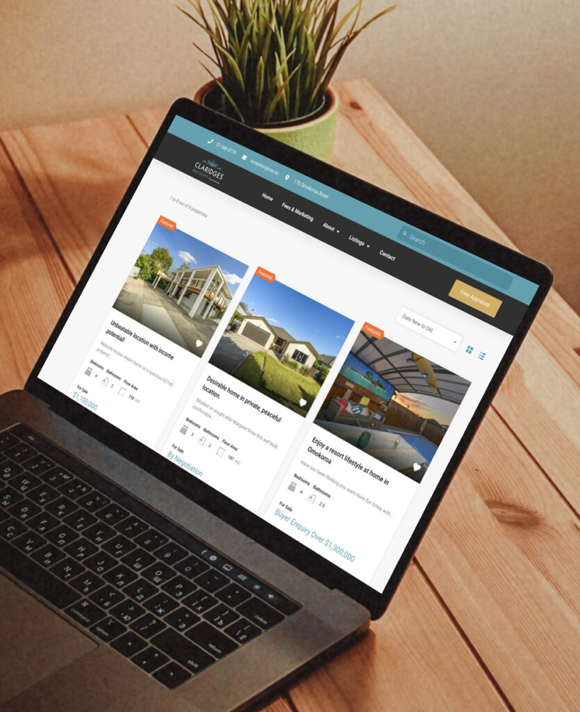 Taranaki Media laptop showcasing client website for Claridges Real Estate
