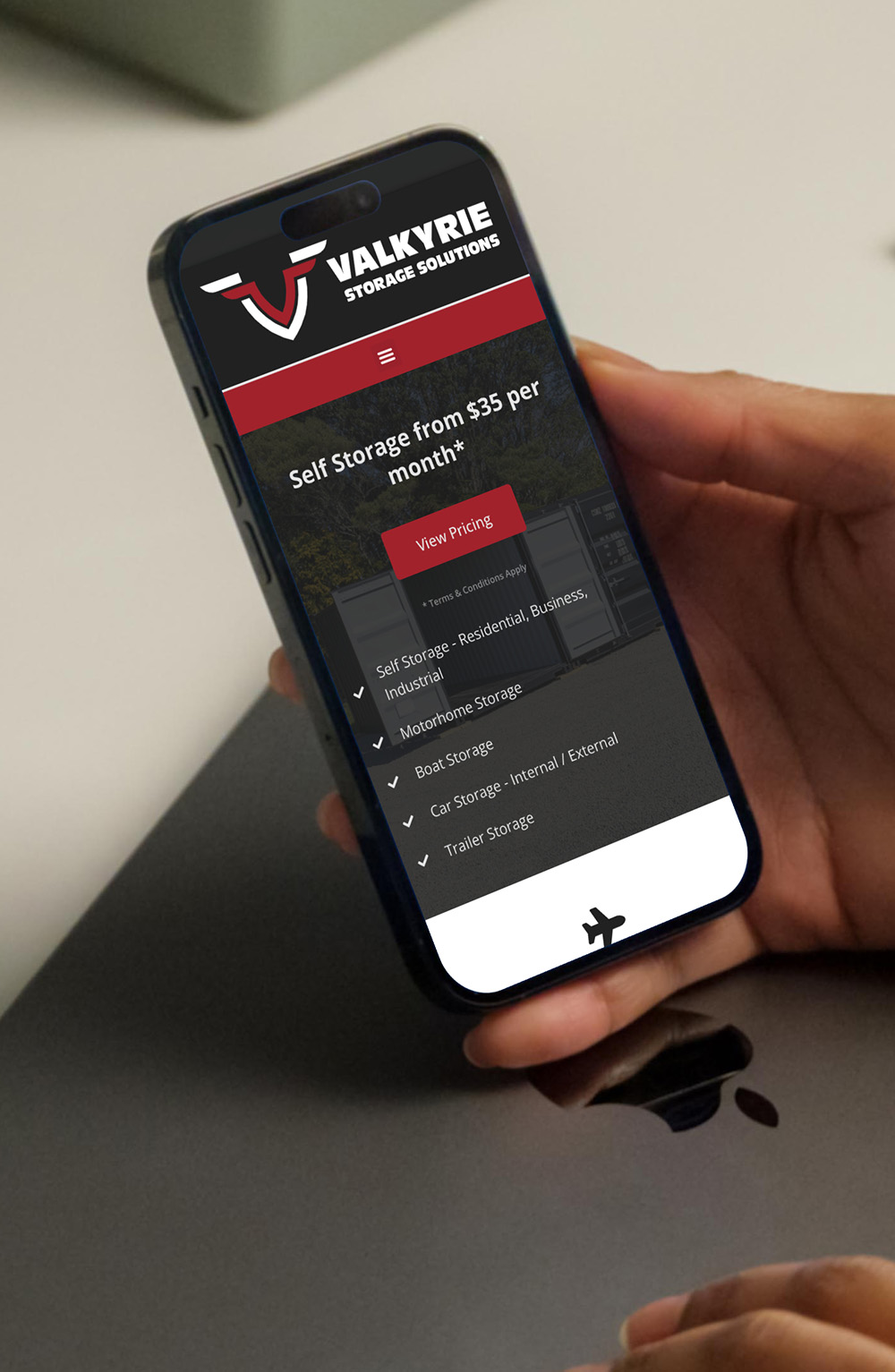 Phone showcasing our Taranaki web design services with the Valkyrie Storage website